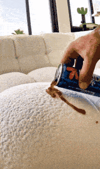NanoPel water-beading demo — cola on sofa